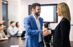 Two business people shaking hands after board recruitment.