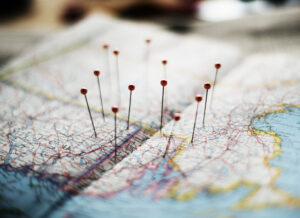 Closeup image of travel pins on a map. Much like a map used for traveling, a capital campaign plan can be your organization's road map to success.