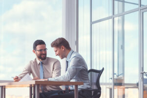 Smiling business people at a meeting in an office. Always be kind.